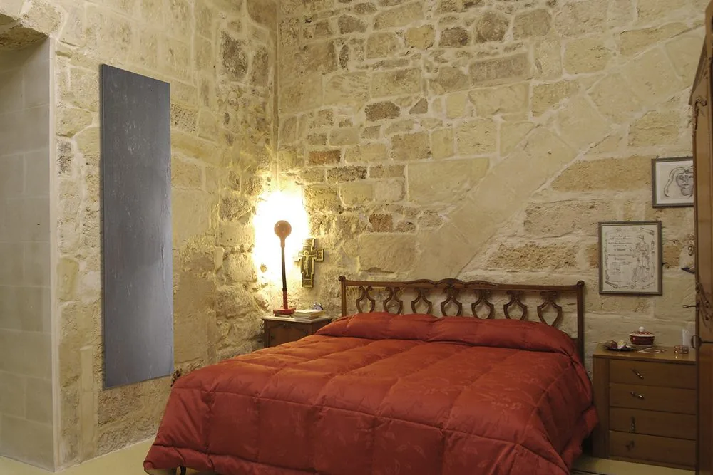Stone against exposed stone. The finish varies panel to panel because the face is genuinely natural stone.