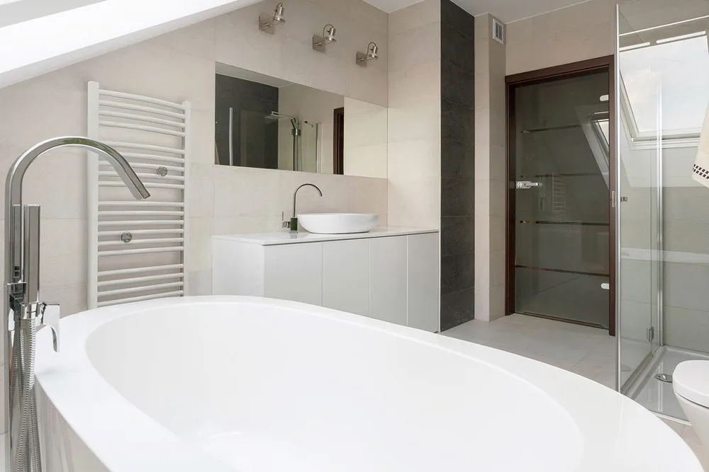The towel-rail format: it heats the bathroom and dries towels off the same panel, in one wall position.